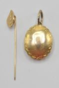 A Victorian 19th century gold front and back plated oval double door locket with chase decoration