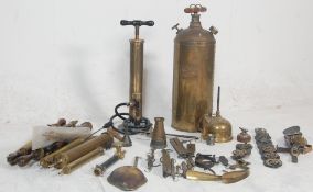 A impressive large collection of 20th century antique brass items to include several brass air pumps