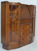 A 1930's Art Deco oak bureau bookcase - display cabinet. Raised on an inset plinth base with end