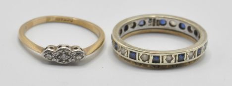 A stamped 9ct gold ring being set with three round cut white stones in platinum settings (size N)