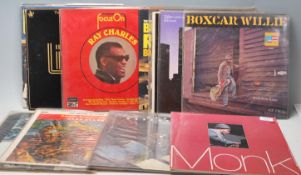 A collection of vintage Jazz long play LP record albums to include: Theolonious Monk, Duke