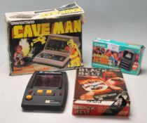 A collection of vintage retro 20th century computer electronic hand held games to include