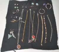 A group of ladies jewellery to include a pair of silver hoop earrings, a pair of large hoop earrings