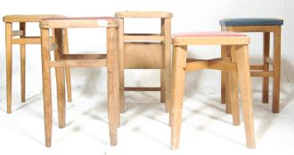 A collection of retro vintage 1970s pine kitchen / breakfast bar stools of various shapes and