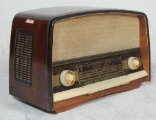 A large mid century walnut lacquered valve radio of lozenge by Orion Imp Type AR 612. The large case
