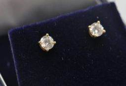 A pair of 18ct yellow  gold and diamond stud earrings with butterfly clasp. The diamonds approx