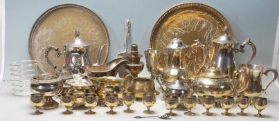 A large quantity of silver plated flatware comprising serving try, tea pot, toaster rack, creamer