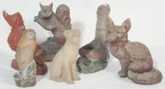 A large collection of vintage 20th century stone garden figurines / statues to include a fox, owl,
