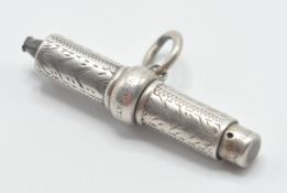 A late 19th Century / early 20th Century silver pocket watch T bar / universal watch key combination