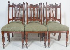 A set of 6 late Victorian mahogany Art Nouveau dining chairs. Raised on turned legs with overstuffed
