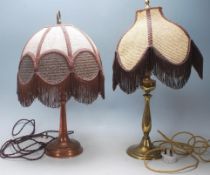 A pair of 1920s early 20th Century Style table / desk lamps having brass bases, shaped stems, fabric