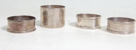 A group of four silver hallmarked napkins rings having hallmarks for Birmingham 1928 Thomas Lyster