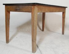 A retro early 20th century country pine refectory dining table with later mid century formica