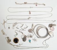 A group of silver jewellery to include three silver bangles with engraved decoration, a fine box