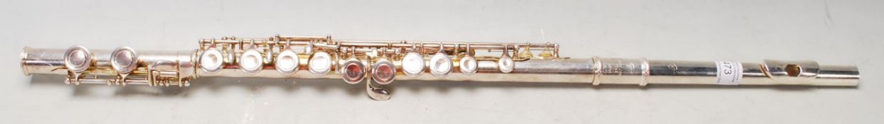 A late 20th Century silver plated straight flute by Trevor James having drawn tone holes and Y arm