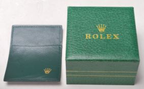 A vintage Rolex watch Geneve Suisse box having a green leather finish with a wave design panel to