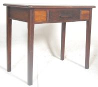 An mid 20th Century 1940s oak writing desk having a chamfered sloping top over a single drawer