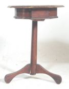 A Victorian 19th century carved oak inlaid tripod games table. Raised on splayed feet with an