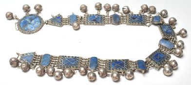 A 20th Century North African silver white metal ceremonial belt constructed from lapis blue stone