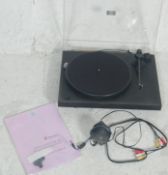 A 20th century  / contemporary Pro-Ject Debut record deck in black colourway with a clear perspex