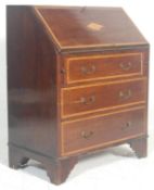 An Edwardian mahogany inlaid bureau desk. Raised on bracket feet with an upright body comprising a