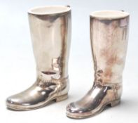 A pair of 20th Century silver plated drinks measures in the form of rising boots with raised