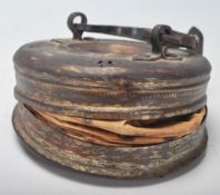 A late 19th / early 20th Century Chinese brass and folded paper lantern with hinged handle to the