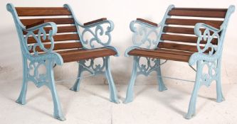 A pair of late 20th Century Victorian style garden seats having wooden slats and shaped foliate