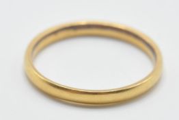 A hallmarked 22ct gold band ring of plain form. Assay marked for London. Weight 1.8g. Size I.5.