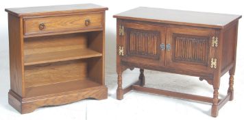 A Jaycee / Old Charm manner bookcase raised on plinth base with central shelves together with a good