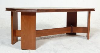 A vintage late 20th century teak wood tile top coffee table having hexagonal shaped top with brown