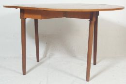 A retro vintage 1970s teak wood drop leaf dining table / Sutherland table having a shaped leaves