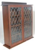 A Victorian 19th century carved oak and leaded glass library bookcase cabinet with plinth base and