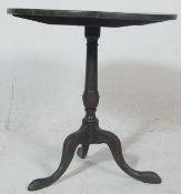 A George III 19th century country oak tilt top wine table / breakfast table. Raised on cabriole