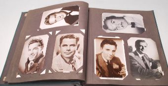 A vintage retro mid Century postcard album filled with black and white photographic postcards of