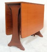 A retro 20th Century G-Plan teak drop leaf dining table having splayed foot frame, the end leaves