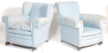 A pair of Victorian 19th century Chesterfield armchairs. Raised on squat bun feet with upholstered