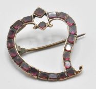 A 18th/ 19th Century Georgian witches heart brooch being set throughout with square cut garnets with