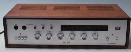 A good 20th century vintage Rogers Ravensbrook Tuner Amplifier having teak wood case with brush