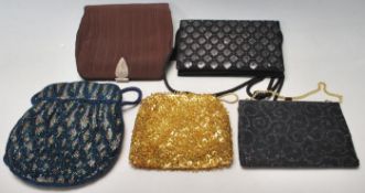 A group of five vintage retro ladies handbags to include a blue and grey beaded handbag, a gold