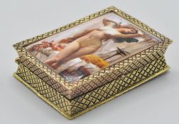 A gold plated silver ladies pill box having an enamel set erotic maiden to the top with chase