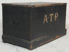 A early 20th century antique black painted shipping box / blanket box having hinged lid revealing
