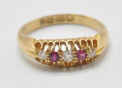 A Victorian / Edwardian hallmarked 18ct gold five stone ring being set with three round cut diamonds