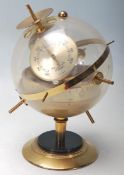 A vintage 20th century Huger Sputnik ES weather station, West German, incorporating a barometer,