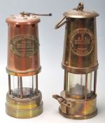 A pair of Victorian 19th century brass and copper miners lamps. Each of cylindrical form with
