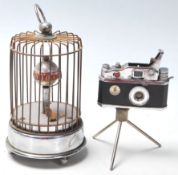 A vintage retro cigarette Photo-Flash lighter in the form of a film camera with spring loaded