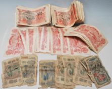 A large collection of 1947 Korean 100 won bank notes ( approx 81 in total ) together with a