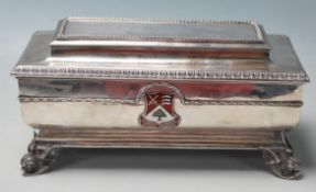 A silver hallmarked 1930's presentational box of sarcophagus form having moulded borders with an