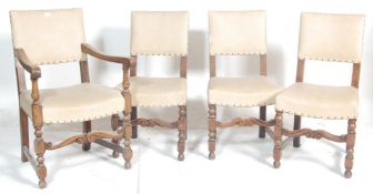 A set of 4 1930's oak panel back Cromwellian style dining chairs. Raised on block and turned legs