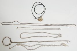 A group of vintage ladies silver necklaces to include a fine figaro necklace chain, a flat link